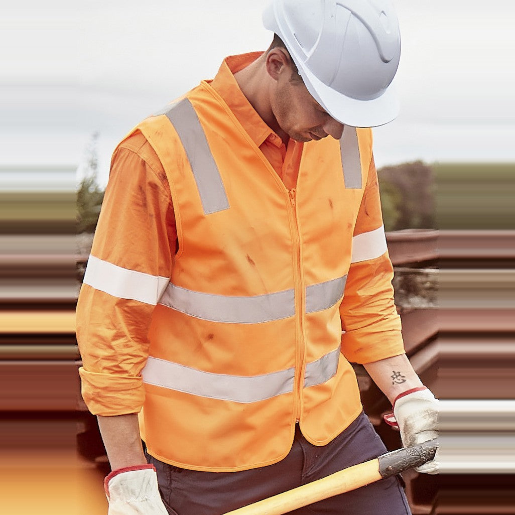 Syzmik Unisex Hi Vis VIC Rail Zip Vest ZV687 in VIC Rail Orange, worn by model