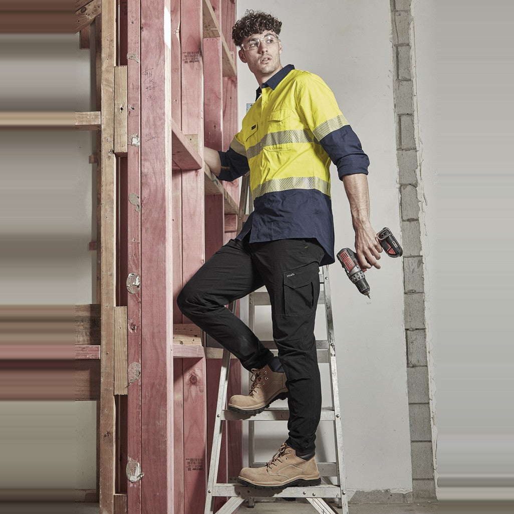 Syzmik Mens Rugged Cooling Hi Vis Segmented Tape Long Sleeve Shirt ZW229 in Yellow/Navy, worn by model