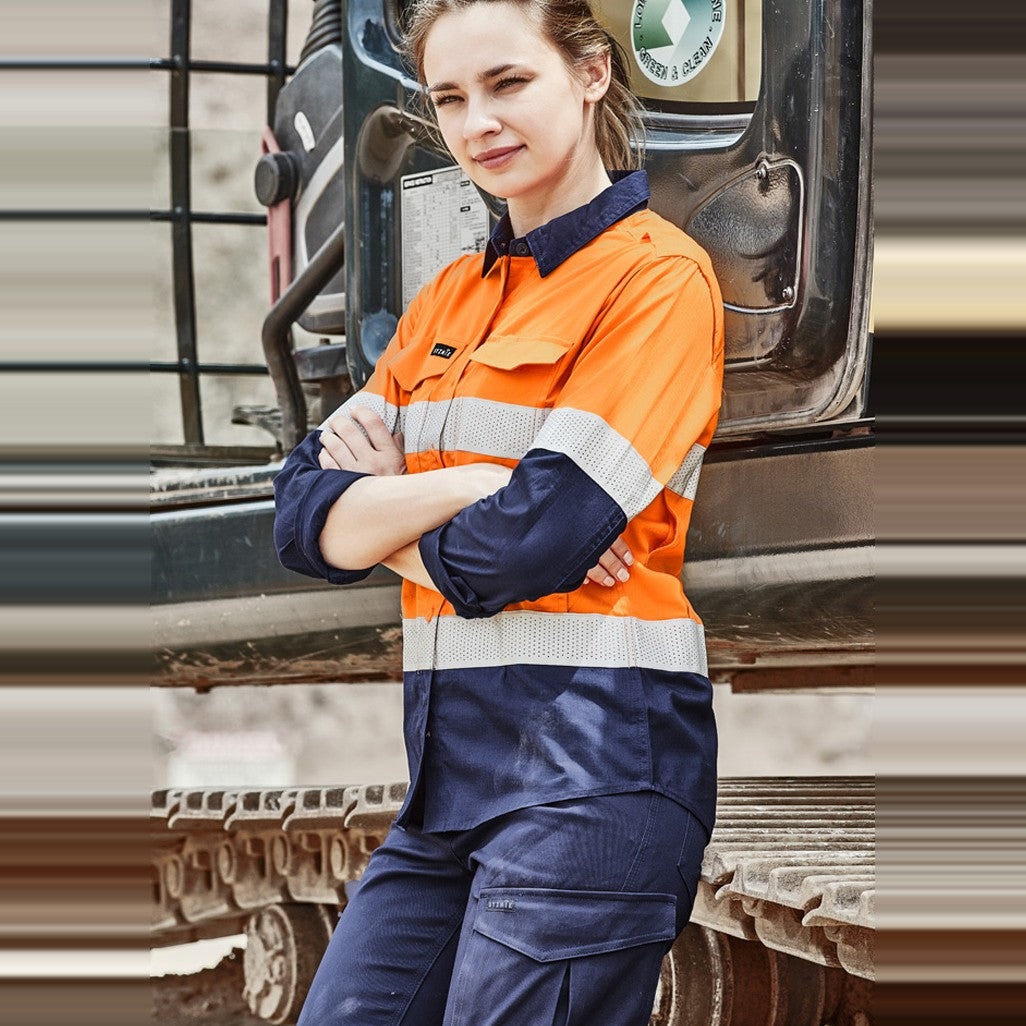 Syzmik Womens Rugged Cooling Hi Vis Taped Long Sleeve Shirt ZW720 in Orange/Navy, worn by model
