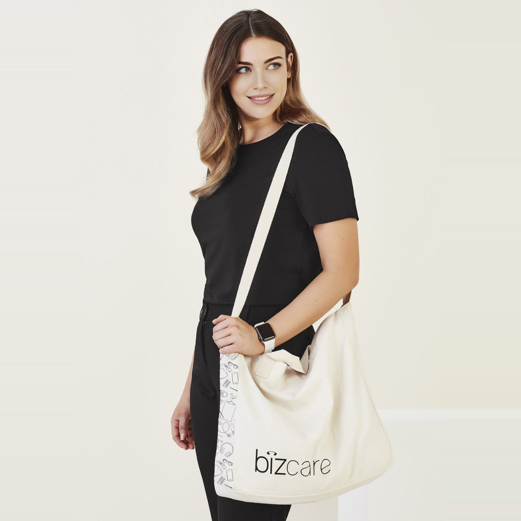 Biz Care Unisex Tote Bag CA044U in Natural, worn by model