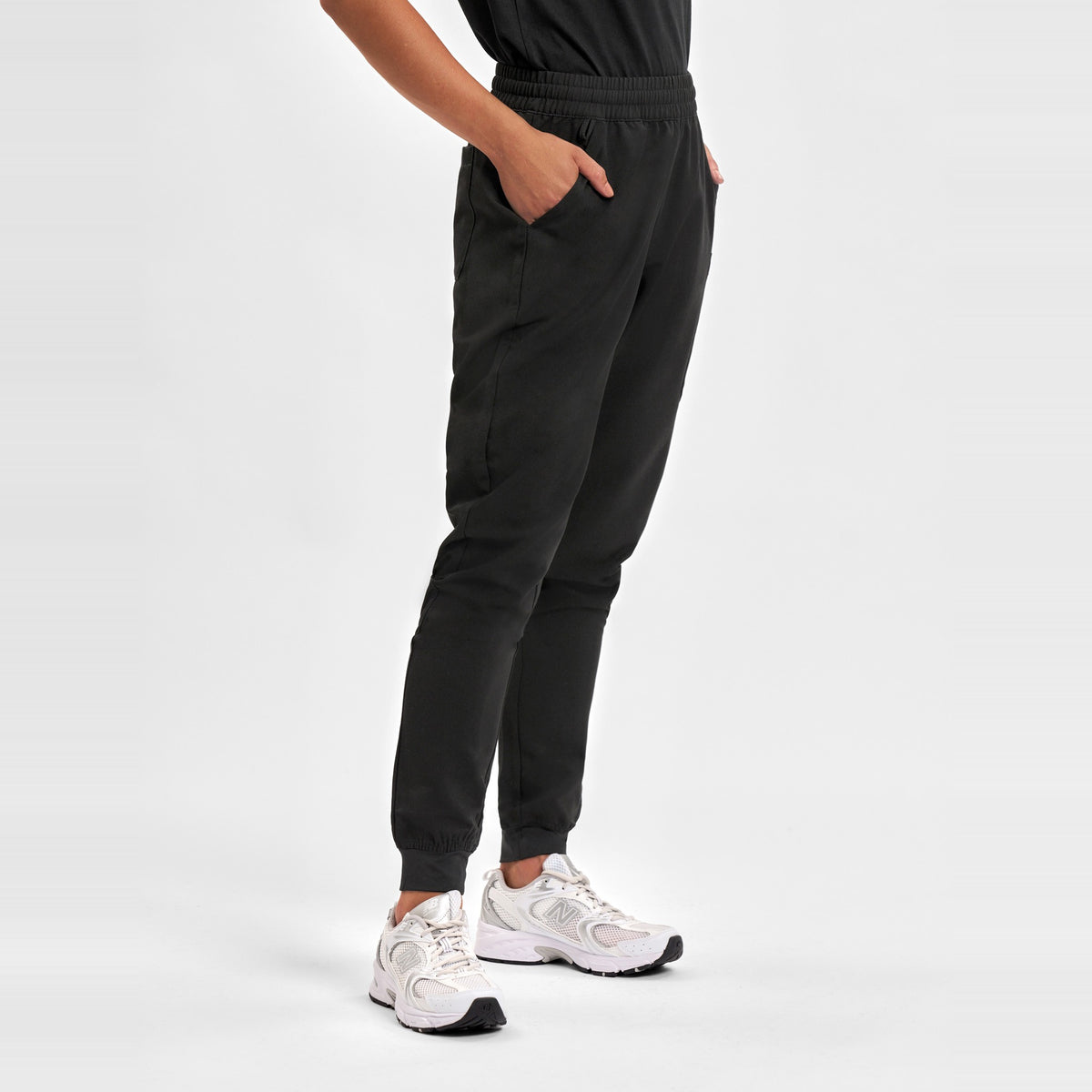 Inaura Pulse Womens Jogger Scrub Pant CL541LL in Black, worn by model, view 3