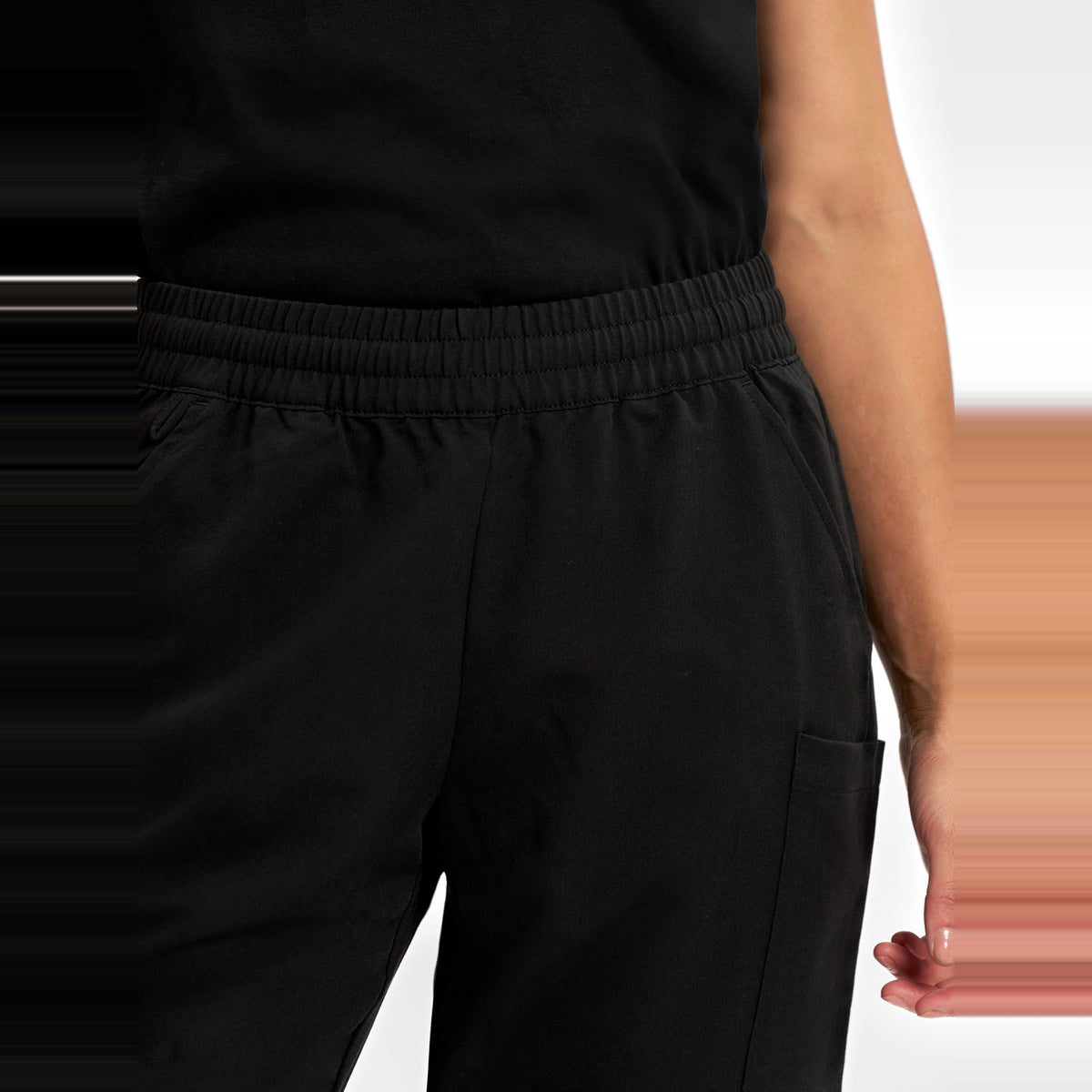 Inaura Pulse Womens Jogger Scrub Pant CL541LL in Black, worn by model, view 5