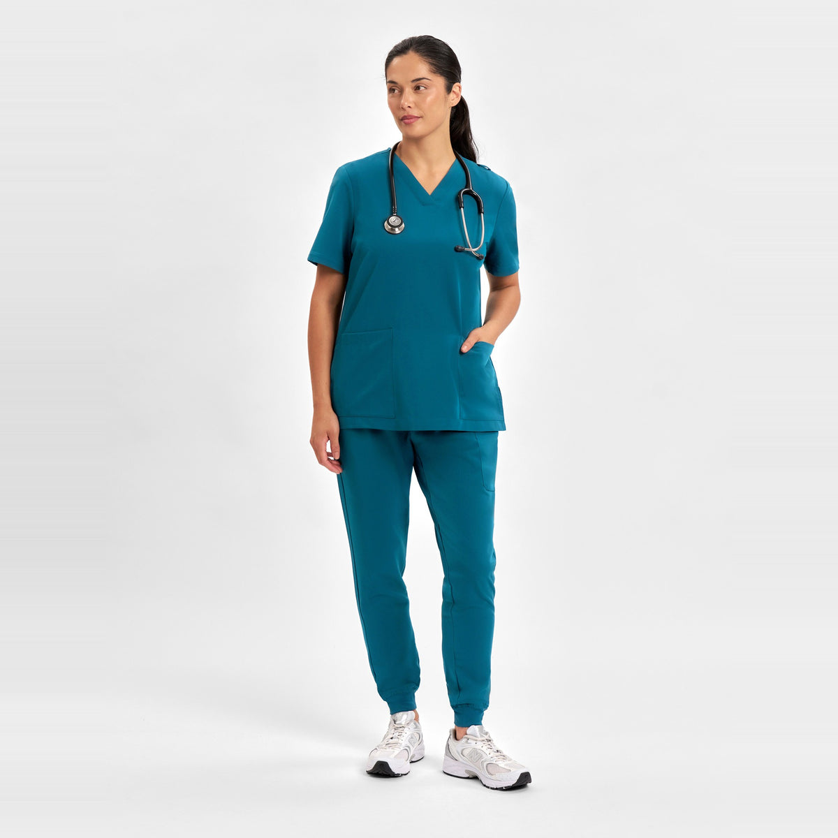 Inaura Pulse Womens Jogger Scrub Pant CL541LL in Caribbean Blue, worn by model