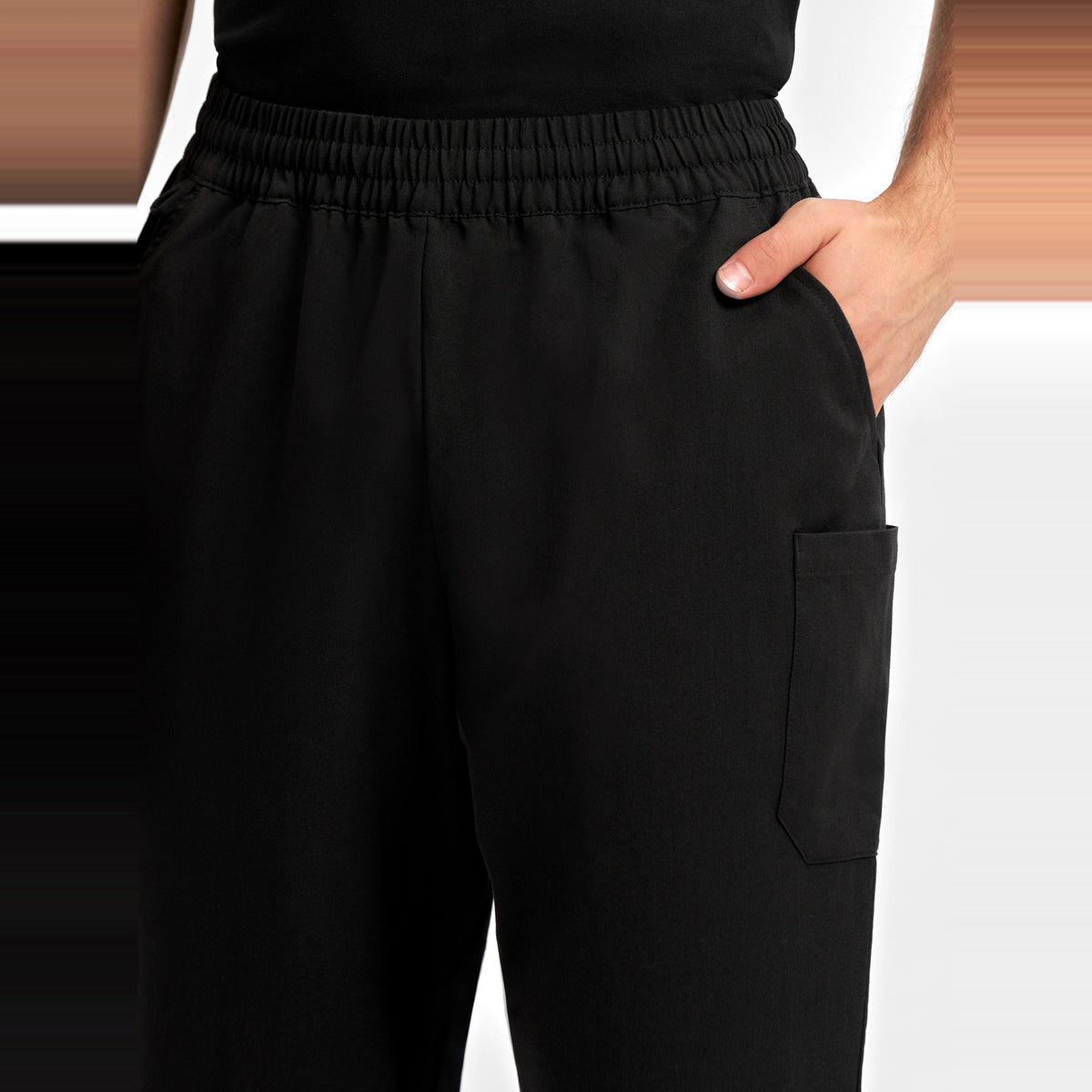 Inaura Pulse Unisex Straight Leg Scrub Pant CL542UL in Black, worn by model, view 5