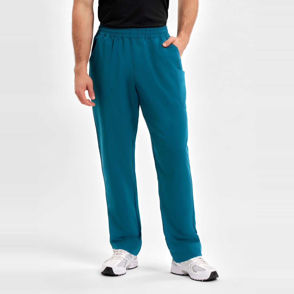 Inaura Pulse Unisex Straight Leg Scrub Pant CL542UL in Caribbean Blue, worn by model, view 2