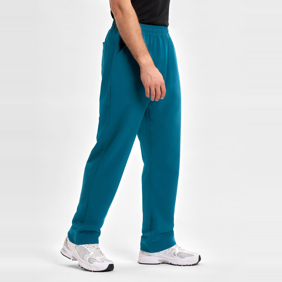 Inaura Pulse Unisex Straight Leg Scrub Pant CL542UL in Caribbean Blue, worn by model, view 4