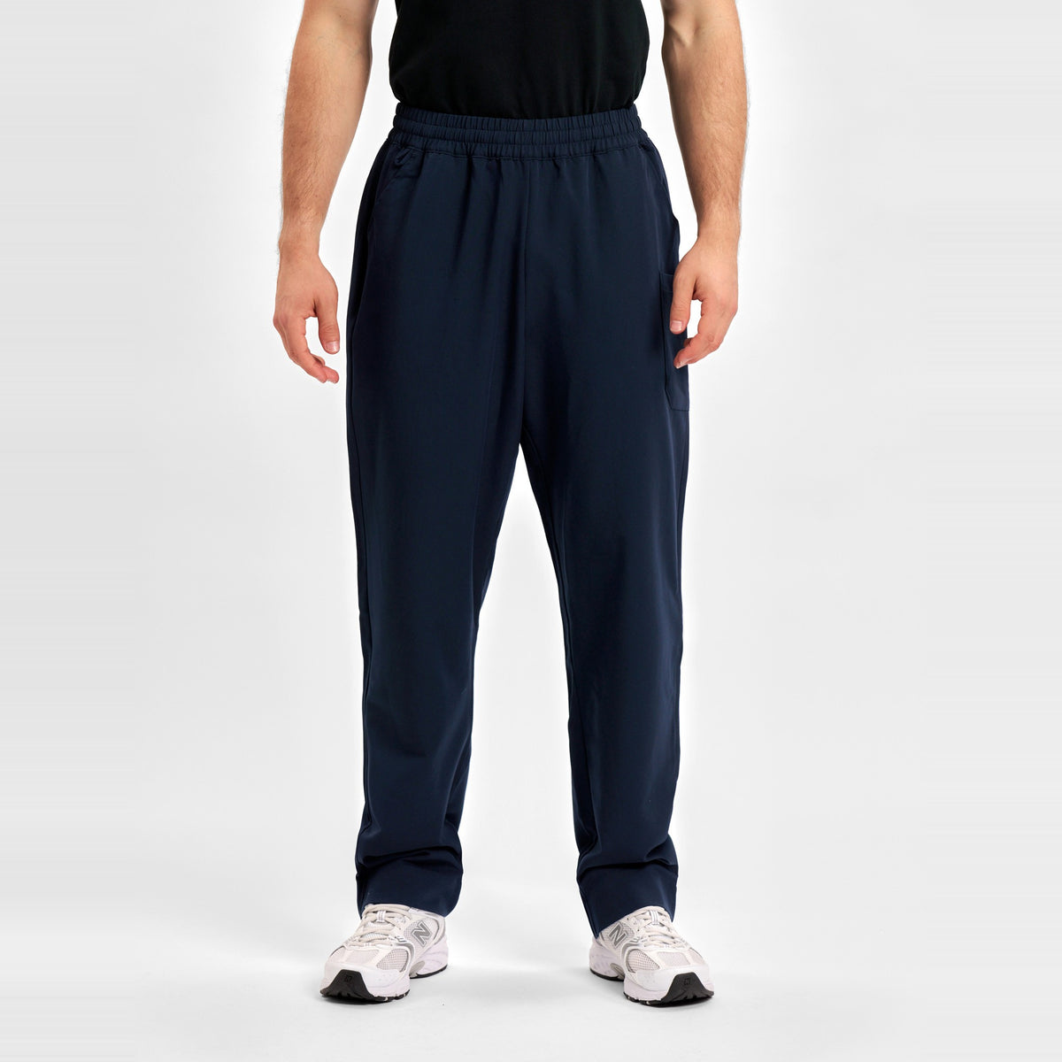 Inaura Pulse Unisex Straight Leg Scrub Pant CL542UL in Midnight Navy, worn by model, view 2