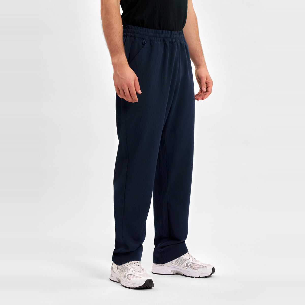 Inaura Pulse Unisex Straight Leg Scrub Pant CL542UL in Midnight Navy, worn by model, view 3