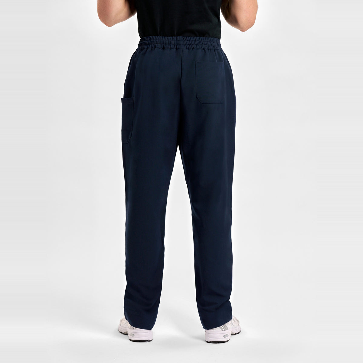 Inaura Pulse Unisex Straight Leg Scrub Pant CL542UL in Midnight Navy, worn by model, view 4