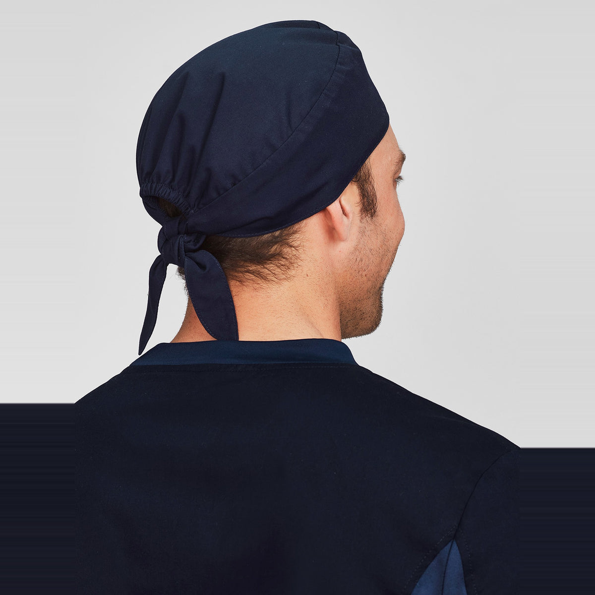 Inaura Reversible Unisex Scrub Cap CSC249U in Midnight Navy, worn by model, view 2