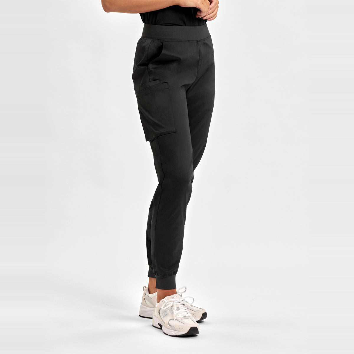 Inaura Riley Womens Slim Leg Jogger Scrub Pant CSP042LL in Black, worn by model, view 3