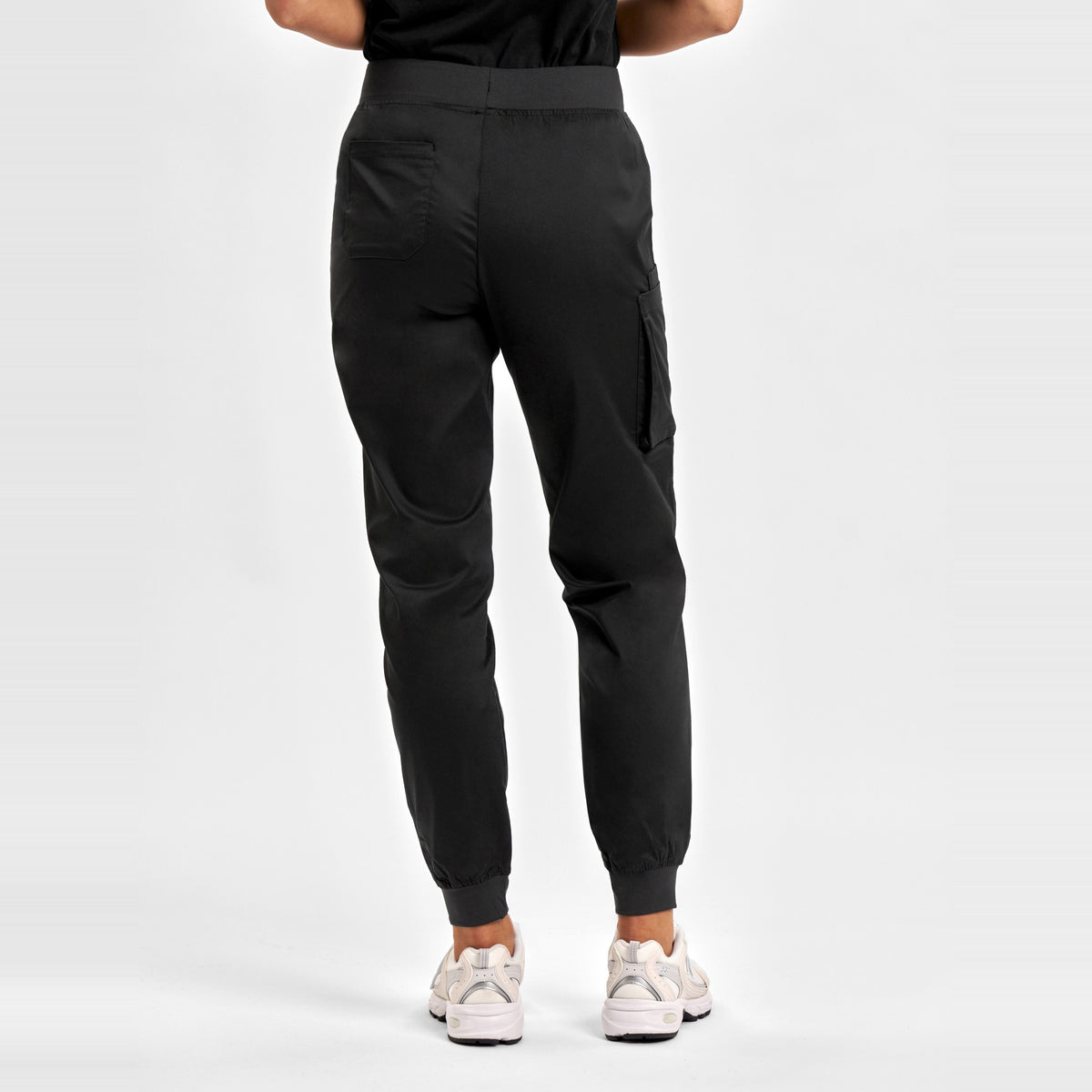 Inaura Riley Womens Slim Leg Jogger Scrub Pant CSP042LL in Black, worn by model, view 4
