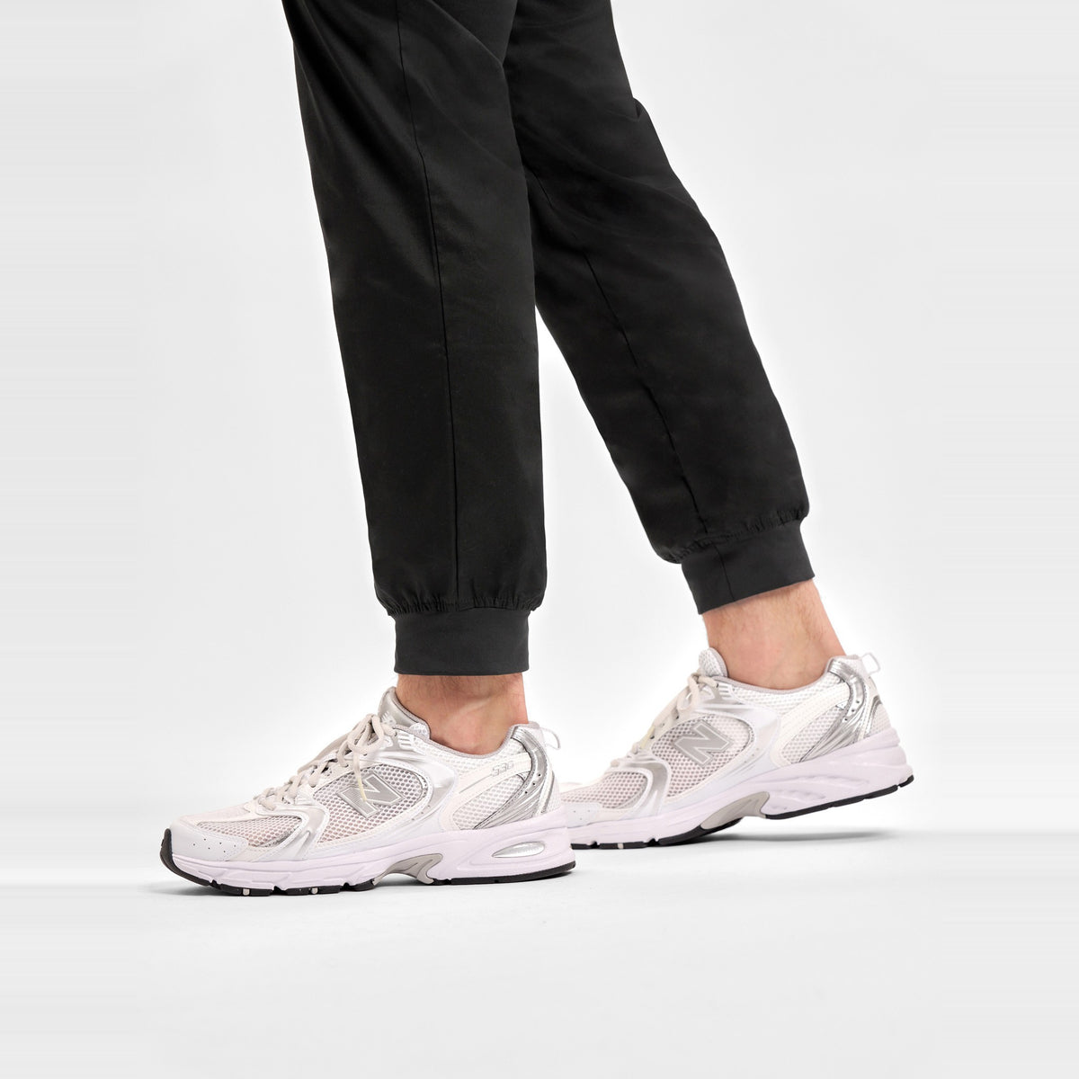 Inaura Riley Mens Slim Leg Jogger Scrub Pant CSP042ML in Black, worn by model, view 6