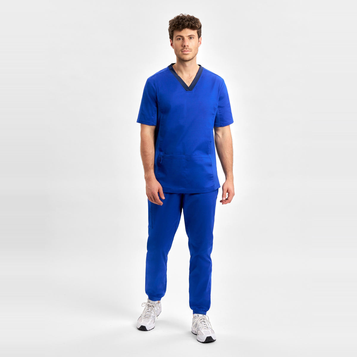 Inaura Riley Mens Slim Leg Jogger Scrub Pant CSP042ML in Electric Blue, worn by model