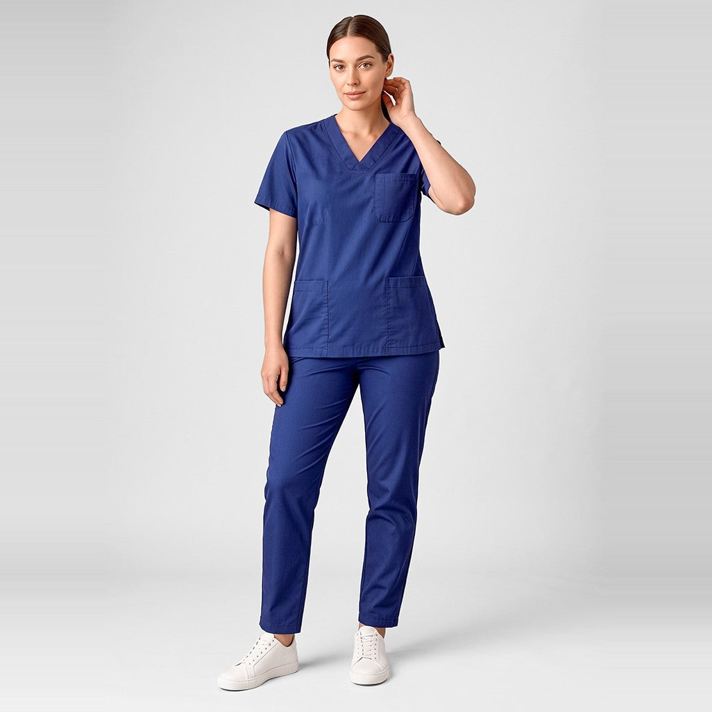 Inaura Hartwell Unisex Reversible Scrub Pant CSP151UL in Dark Blue, worn by model
