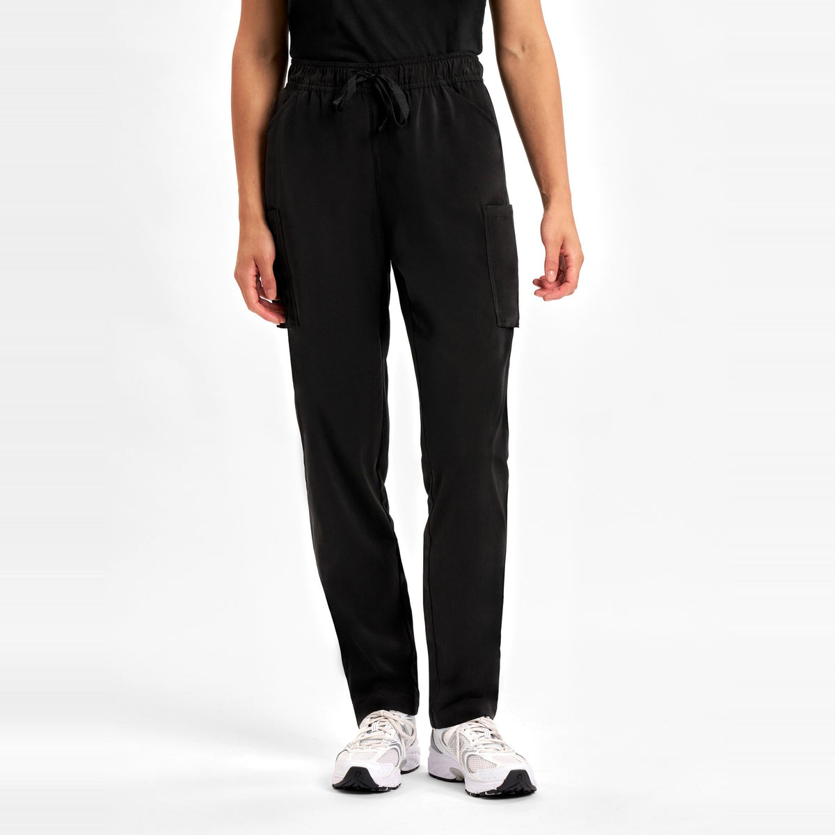 Inaura Avery Womens Slim Leg Scrub Pant CSP943LL in Black, worn by model, view 2