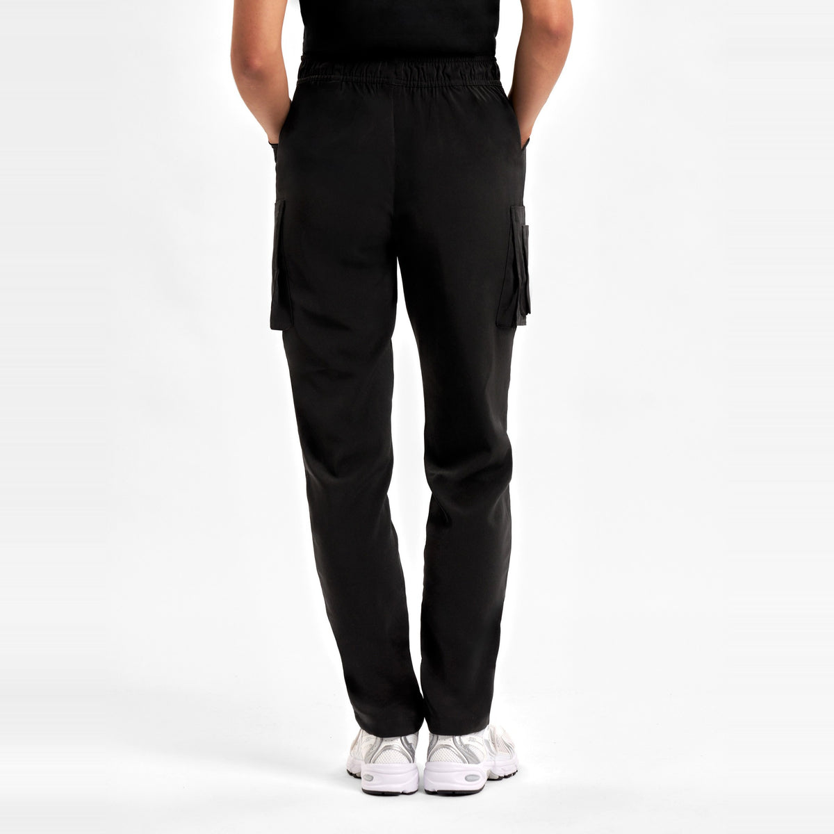 Inaura Avery Womens Slim Leg Scrub Pant CSP943LL in Black, worn by model, view 4