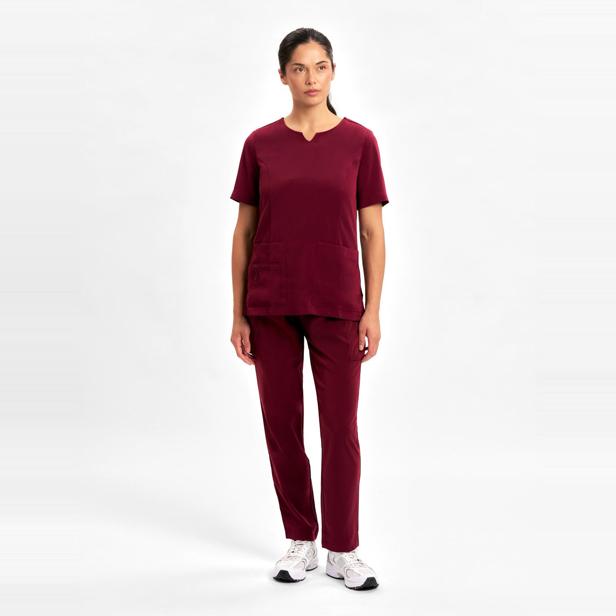 Inaura Avery Womens Slim Leg Scrub Pant CSP943LL in Burgundy, worn by model