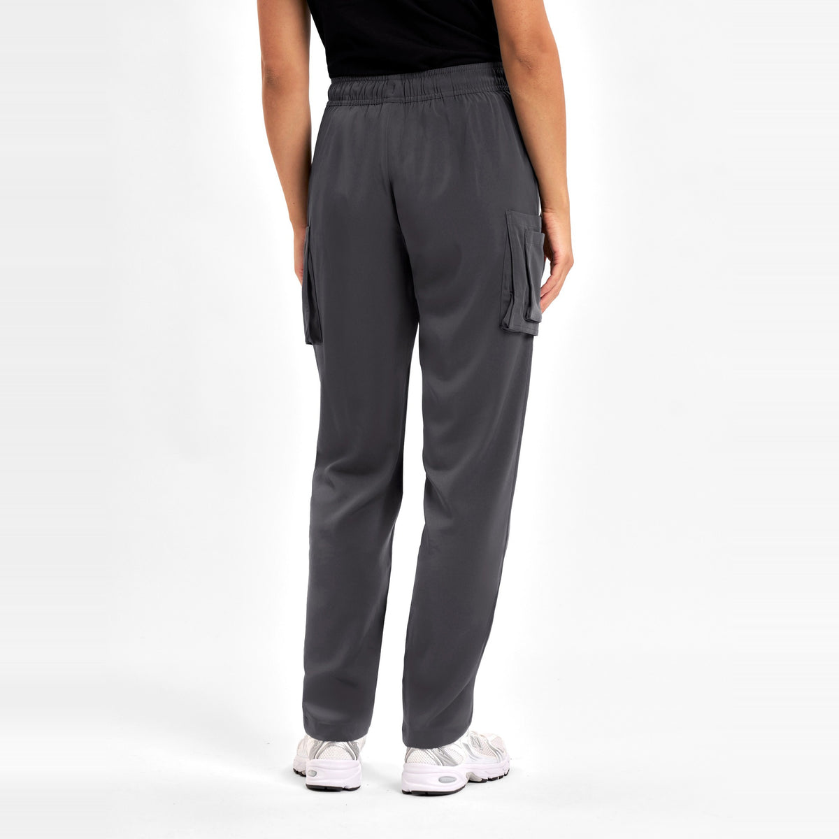 Inaura Avery Womens Slim Leg Scrub Pant CSP943LL in Charcoal, worn by model, view 4