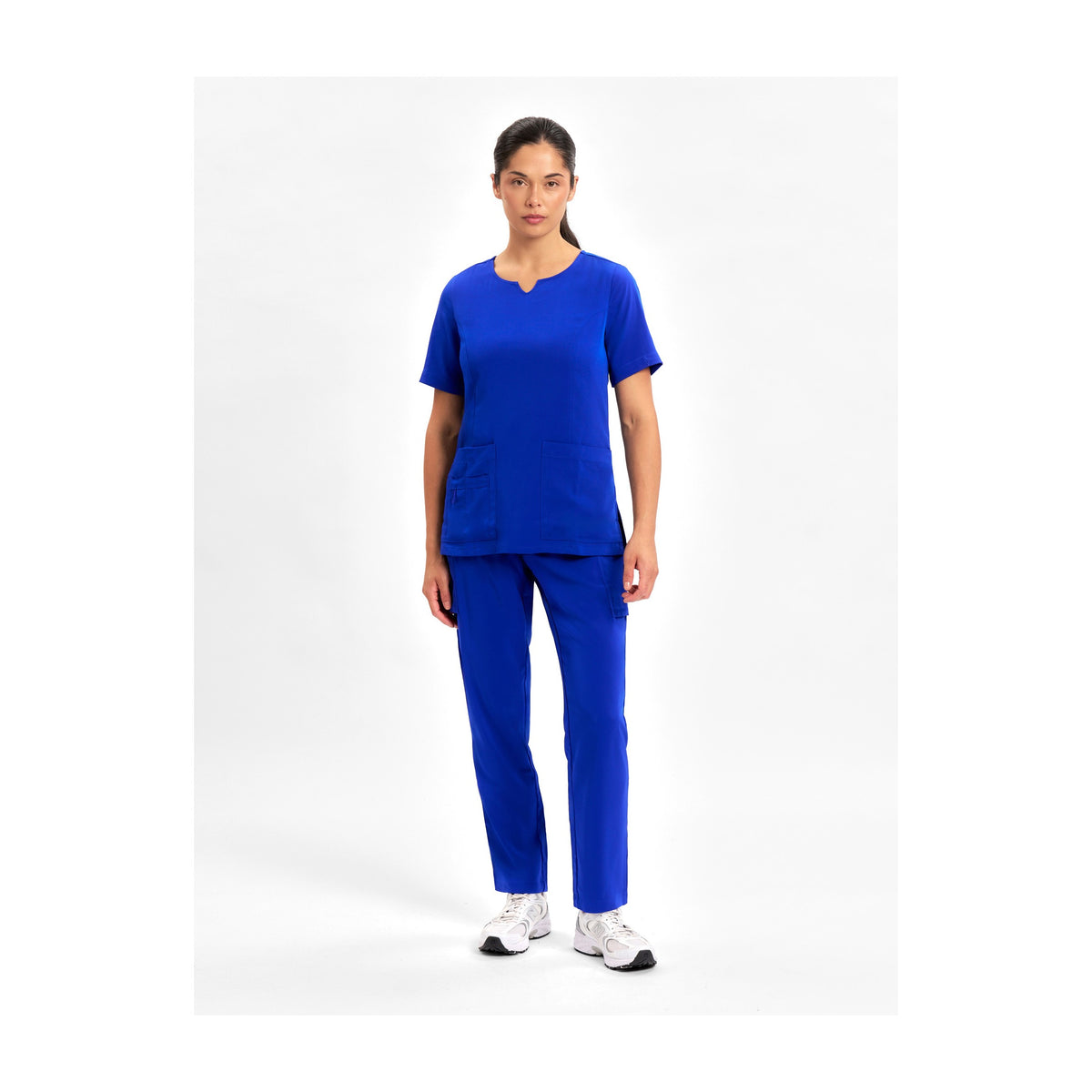 Inaura Avery Womens Slim Leg Scrub Pant CSP943LL in Electric Blue, worn by model