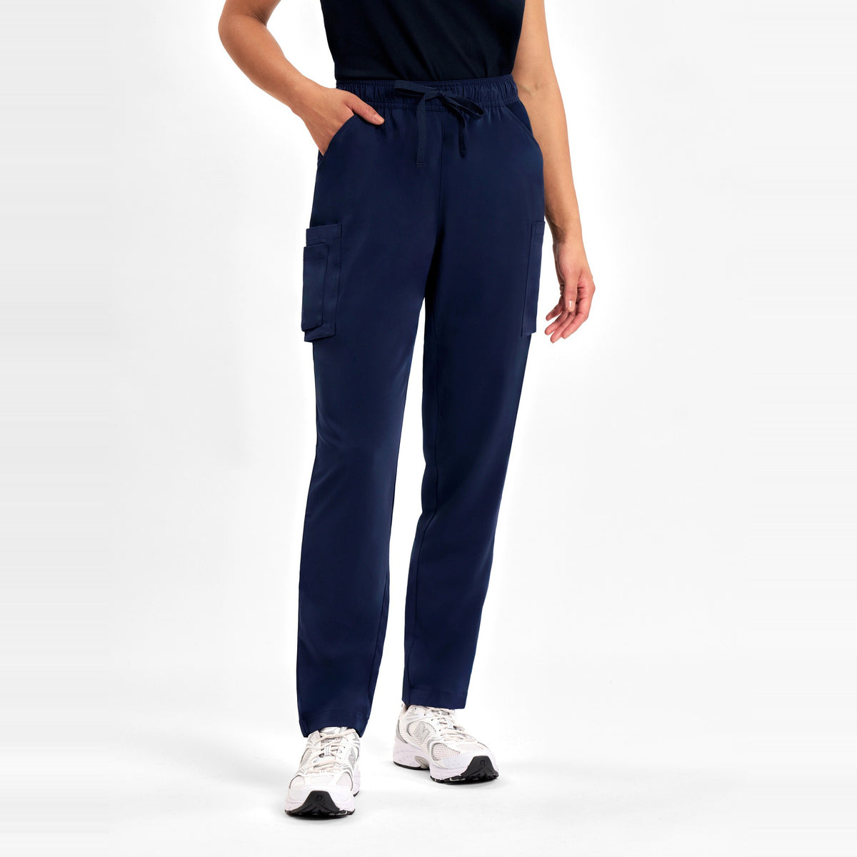 Inaura Avery Womens Slim Leg Scrub Pant CSP943LL in Midnight Navy, worn by model, view 2