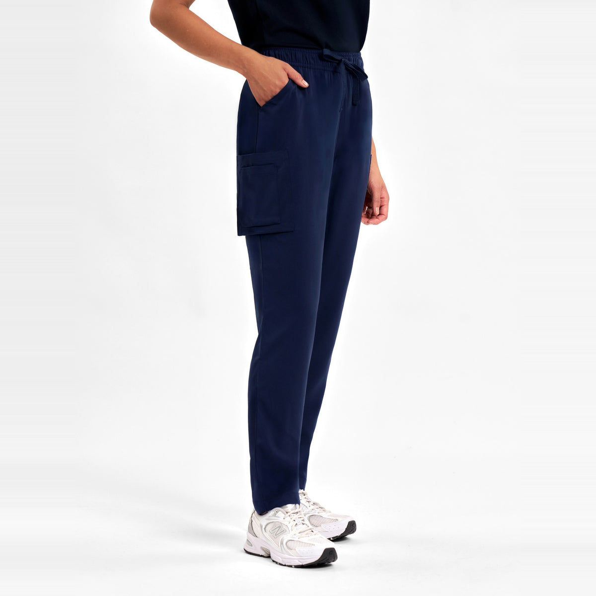 Inaura Avery Womens Slim Leg Scrub Pant CSP943LL in Midnight Navy, worn by model, view 3