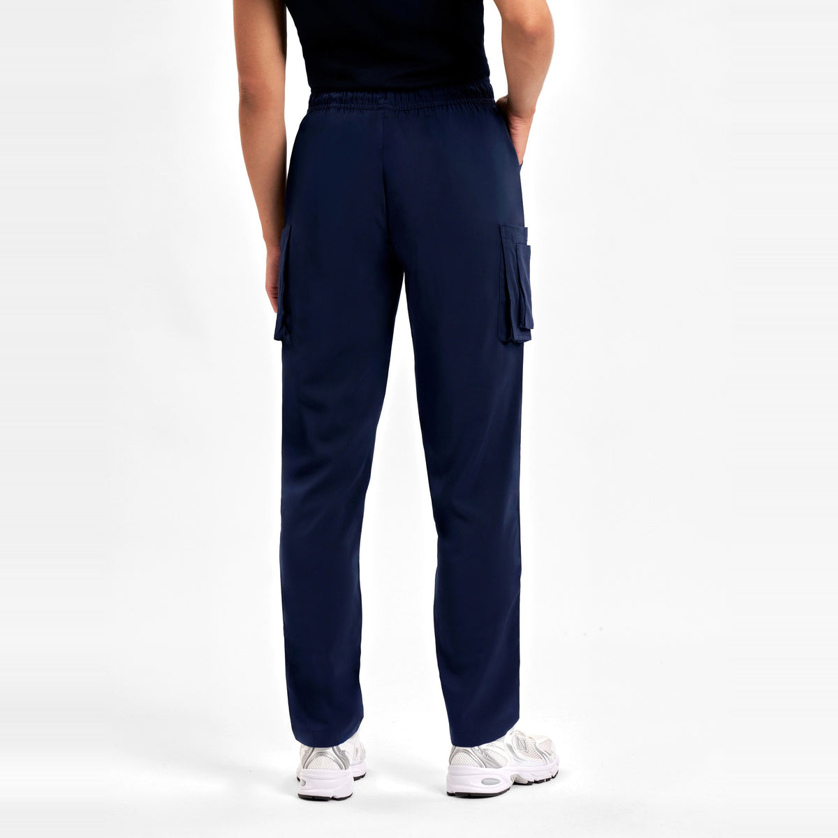 Inaura Avery Womens Slim Leg Scrub Pant CSP943LL in Midnight Navy, worn by model, view 4