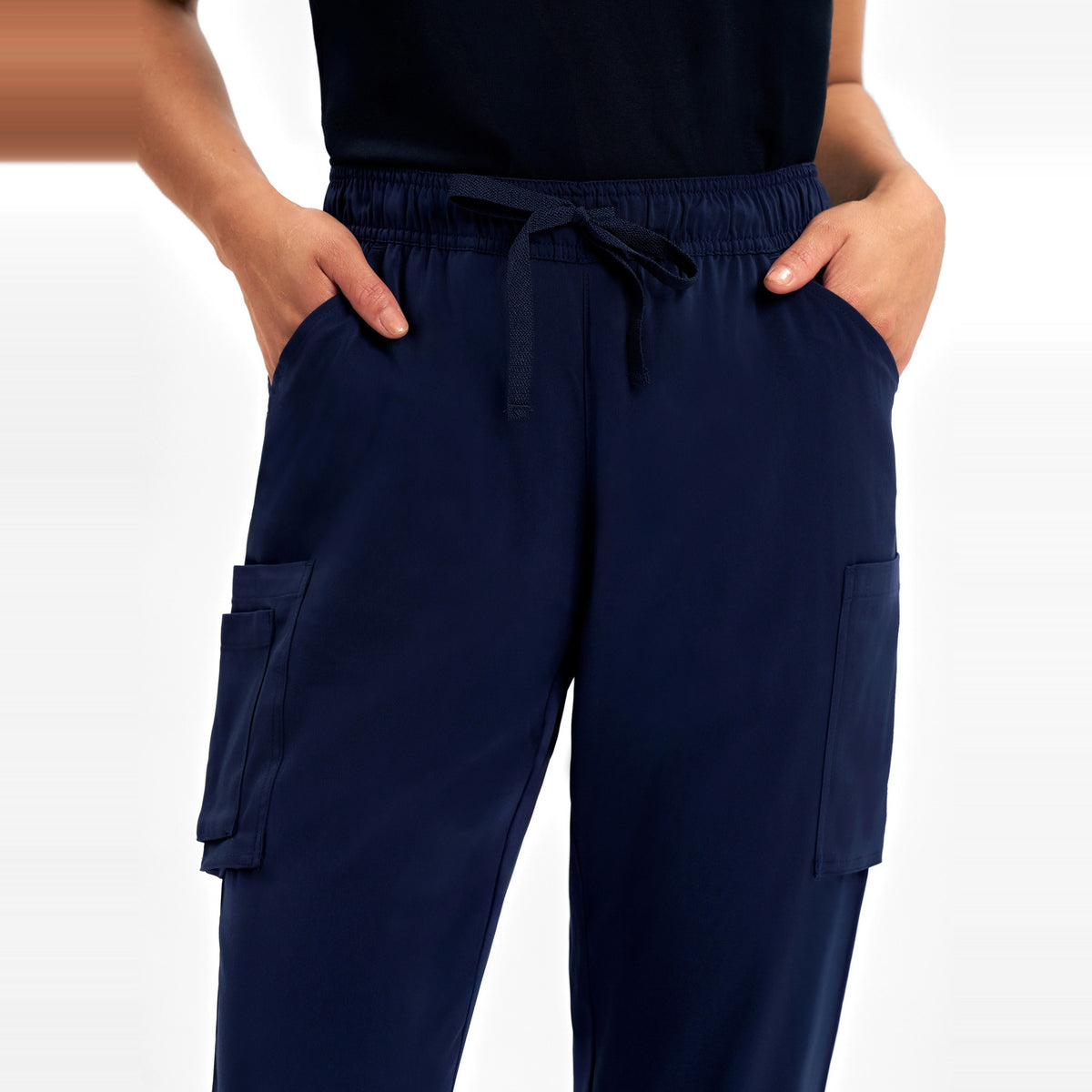 Inaura Avery Womens Slim Leg Scrub Pant CSP943LL in Midnight Navy, worn by model, view 5