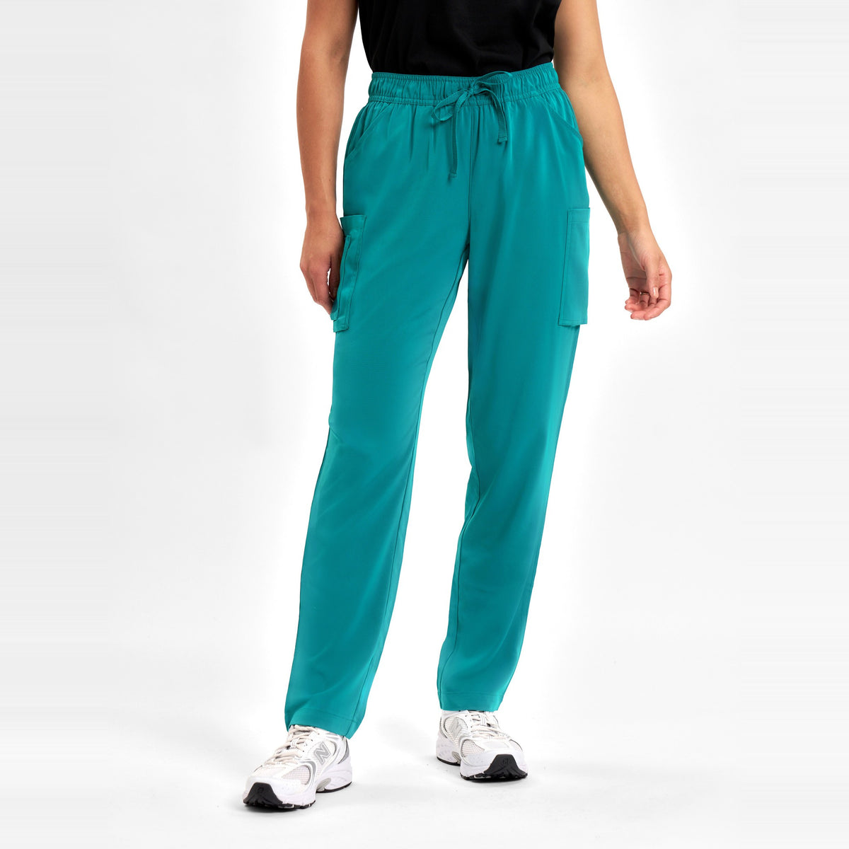 Inaura Avery Womens Slim Leg Scrub Pant CSP943LL in Teal, worn by model, view 2