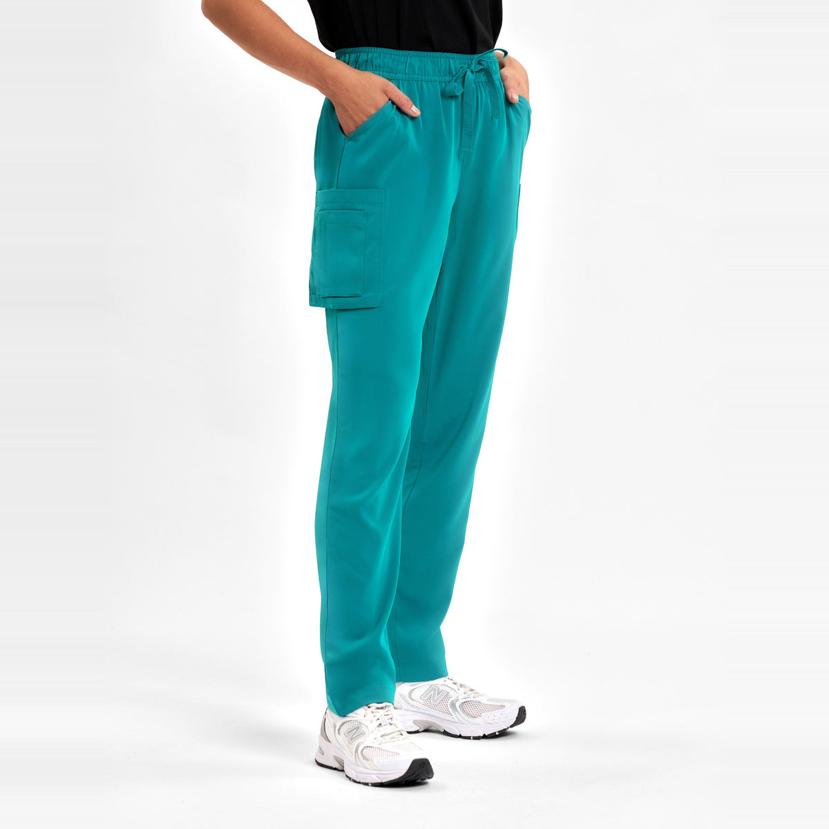 Inaura Avery Womens Slim Leg Scrub Pant CSP943LL in Teal, worn by model, view 3