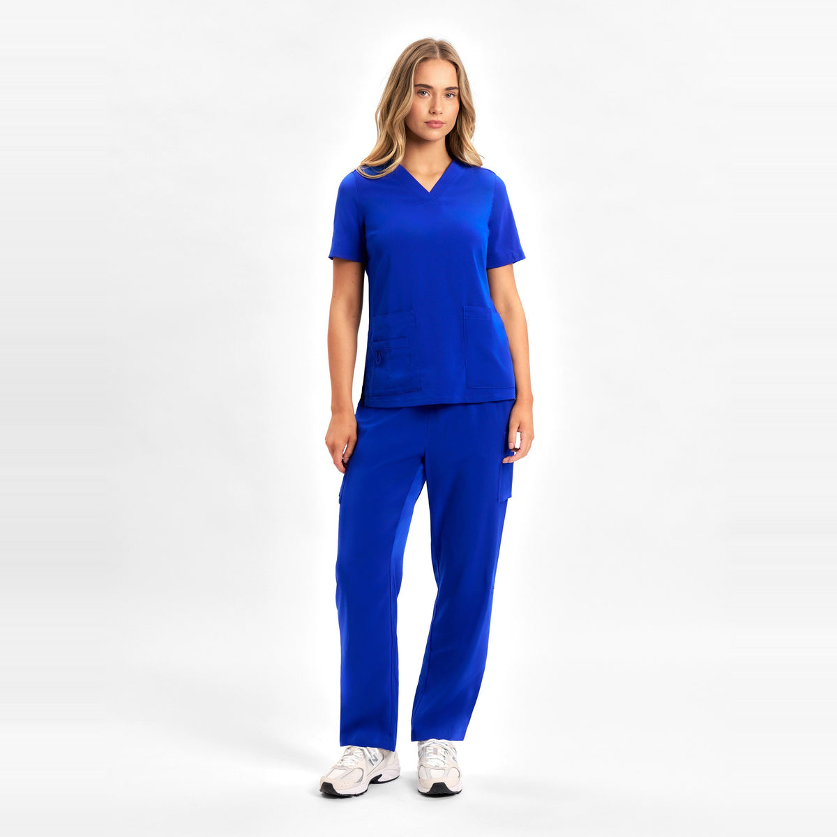 Inaura Avery Womens Straight Leg Scrub Pant CSP944LL in Electric Blue, worn by model