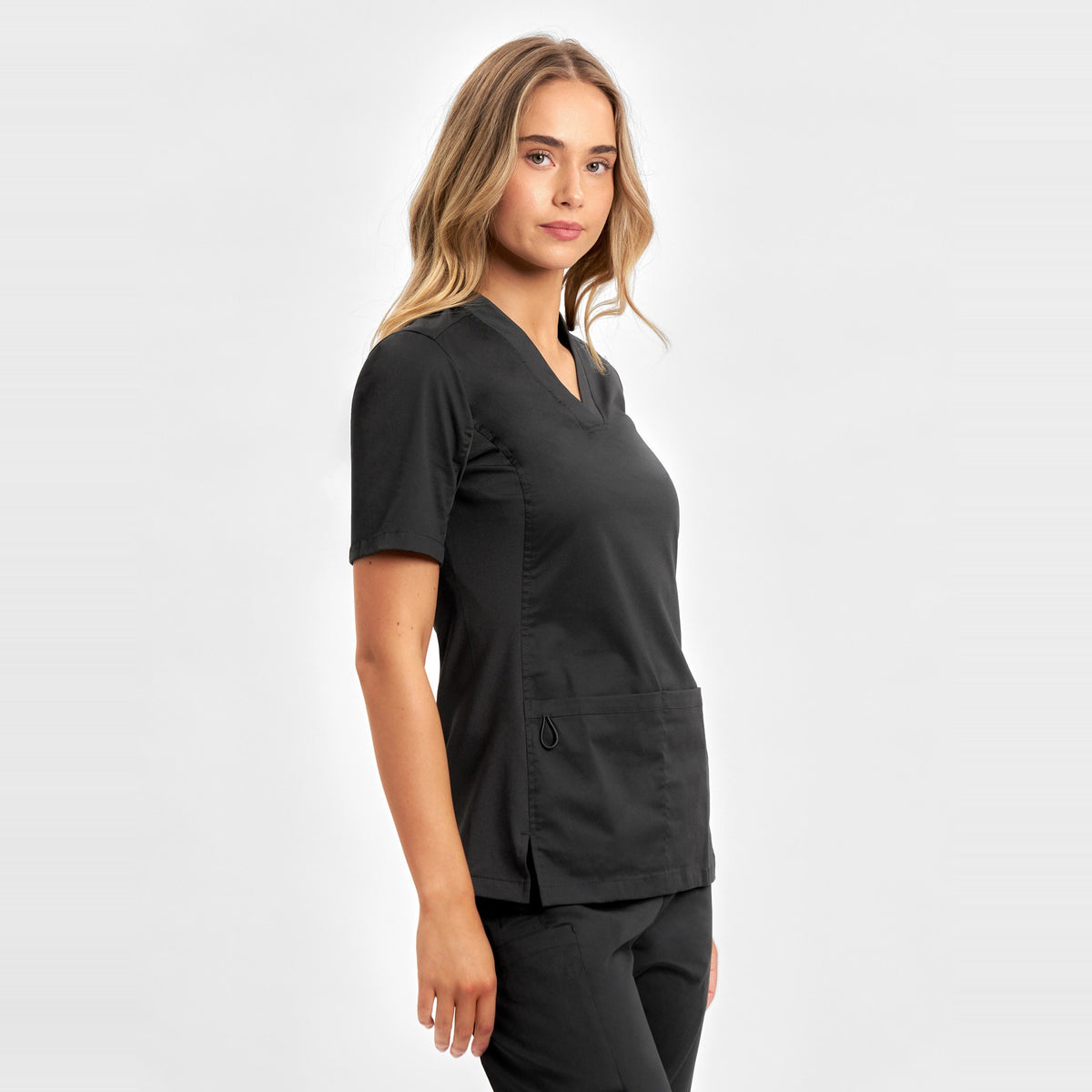 Inaura Riley Womens Stretch Scrub Top CST043LS in Black, worn by model, view 3