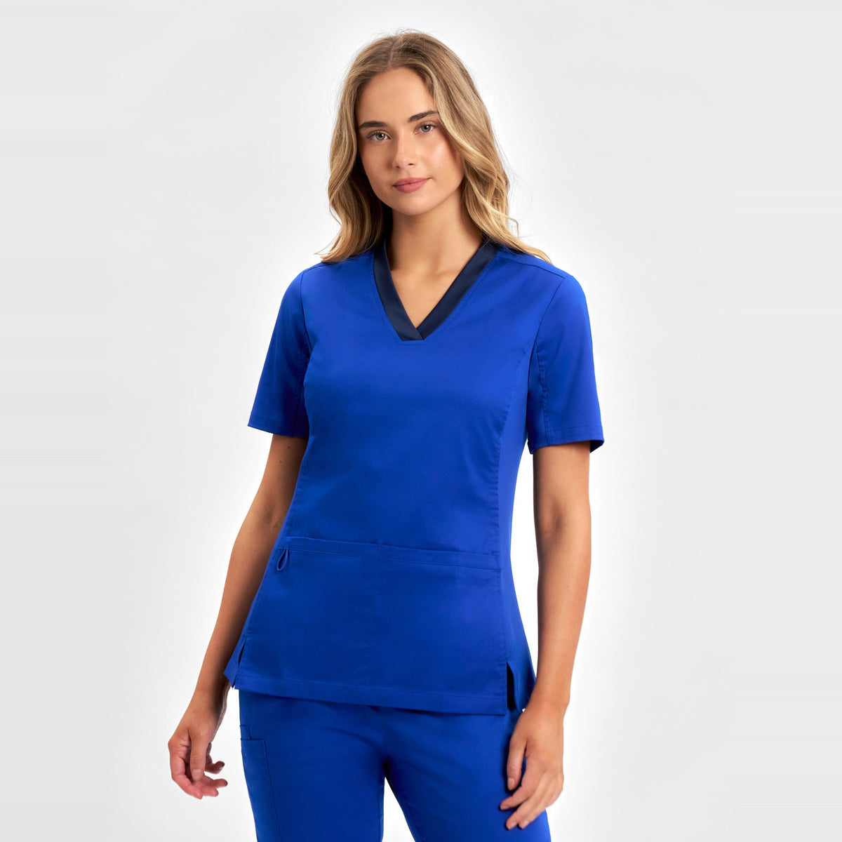 Inaura Riley Womens Stretch Scrub Top CST043LS in Electric Blue, worn by model