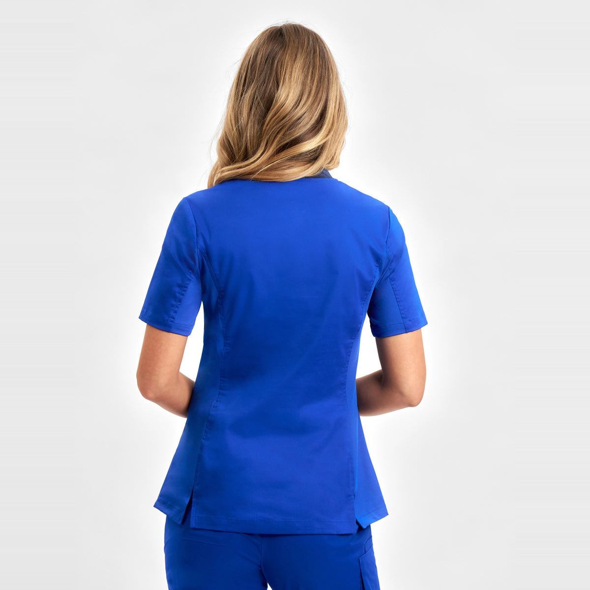 Inaura Riley Womens Stretch Scrub Top CST043LS in Electric Blue, worn by model, view 4