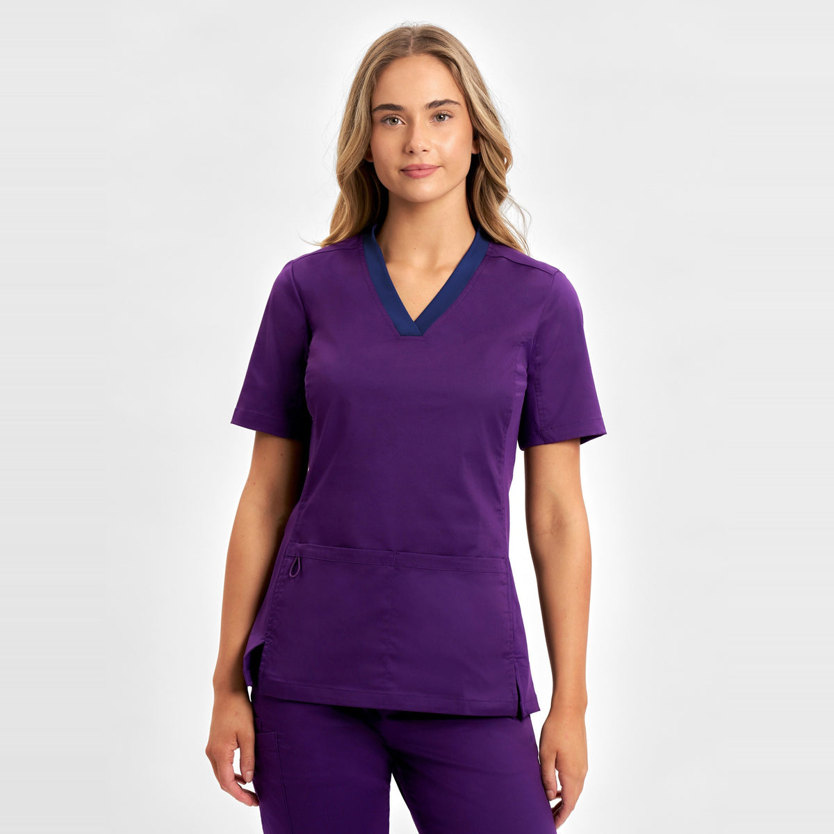 Inaura Riley Womens Stretch Scrub Top CST043LS in Purple, worn by model