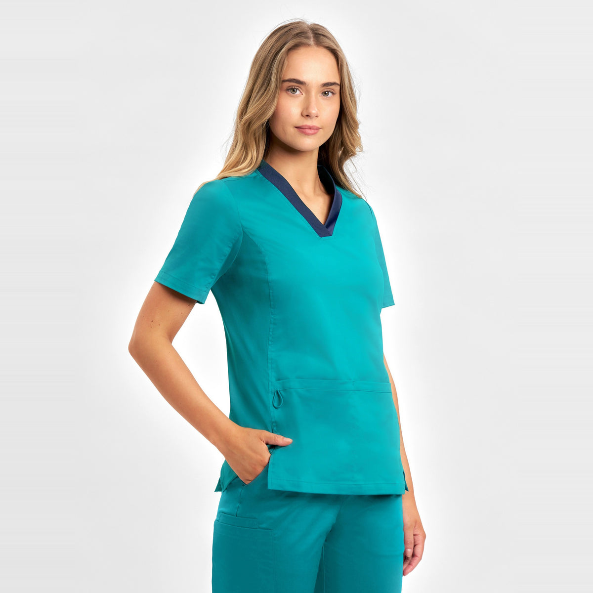 Inaura Riley Womens Stretch Scrub Top CST043LS in Teal, worn by model, view 3
