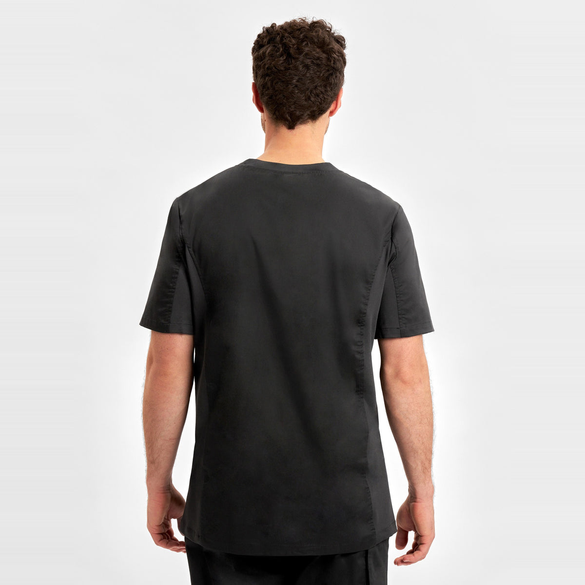 Inaura Riley Mens Stretch Scrub Top CST043MS in Black, worn by model, view 4