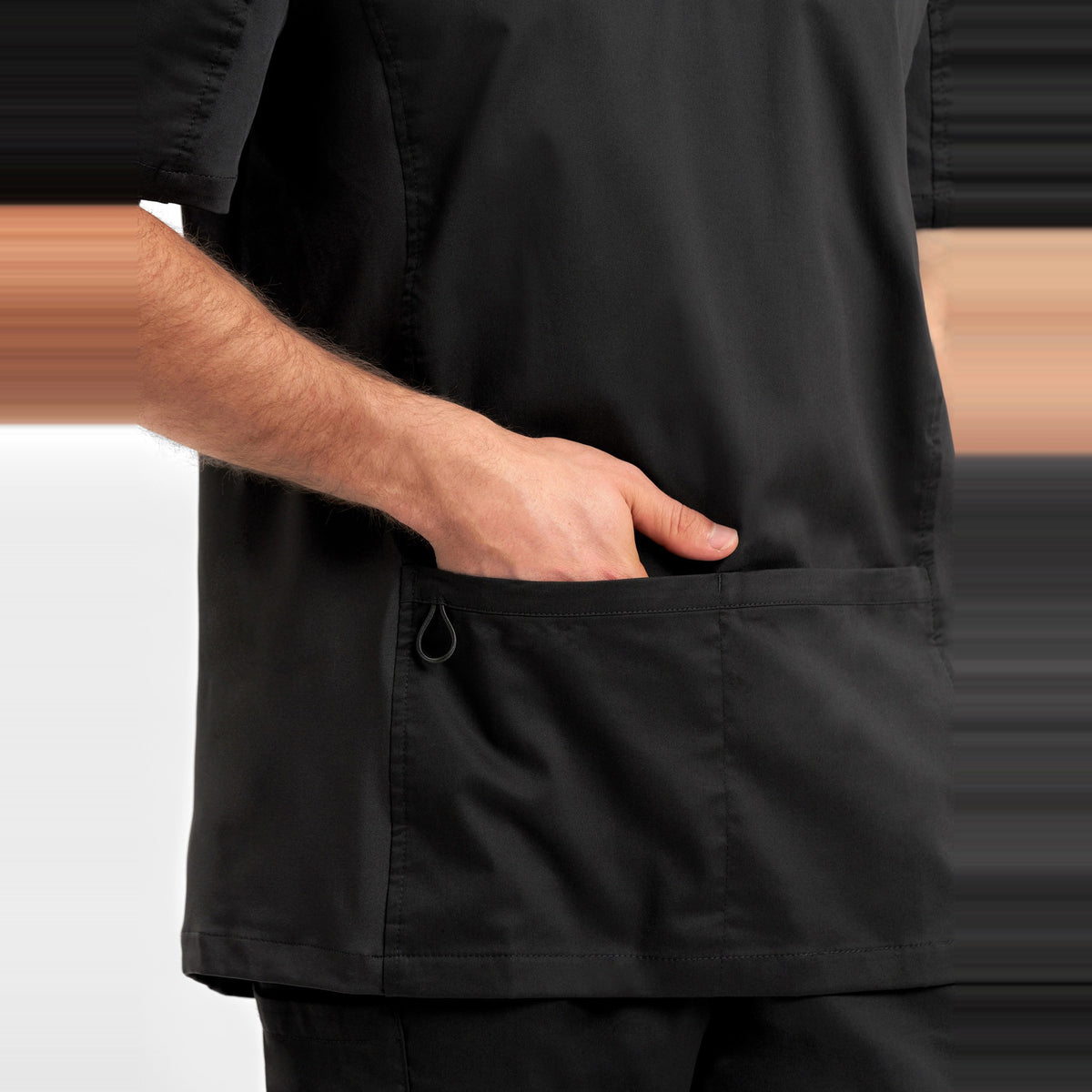 Inaura Riley Mens Stretch Scrub Top CST043MS in Black, worn by model, view 5