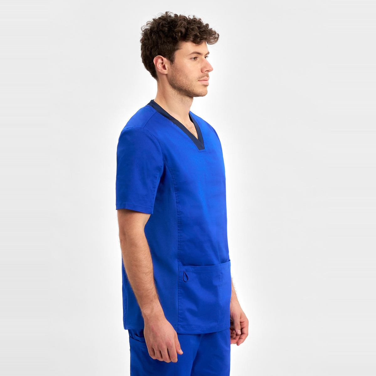 Inaura Riley Mens Stretch Scrub Top CST043MS in Electric Blue, worn by model, view 3