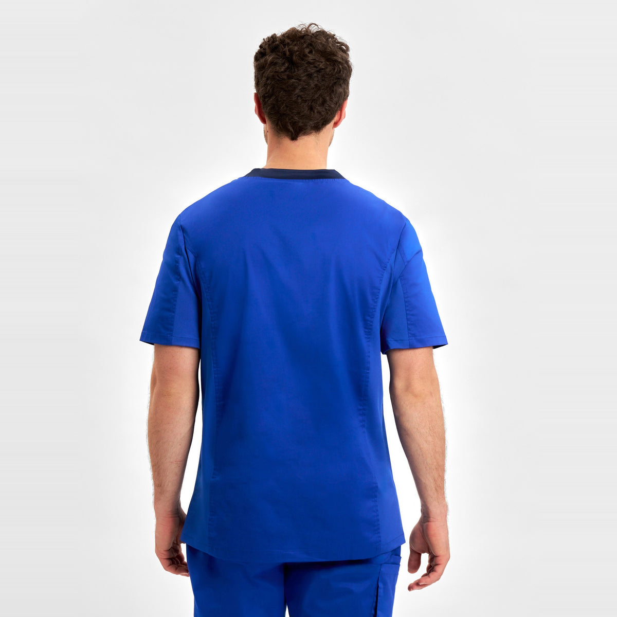Inaura Riley Mens Stretch Scrub Top CST043MS in Electric Blue, worn by model, view 4