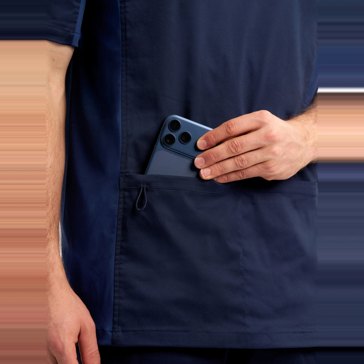 Inaura Riley Mens Stretch Scrub Top CST043MS in Midnight Navy, worn by model, view 6