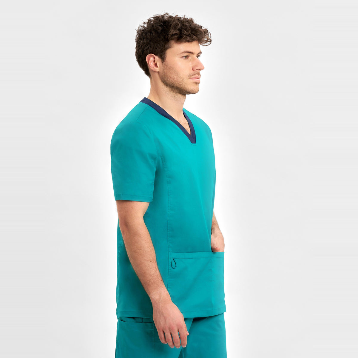 Inaura Riley Mens Stretch Scrub Top CST043MS in Teal, worn by model, view 3