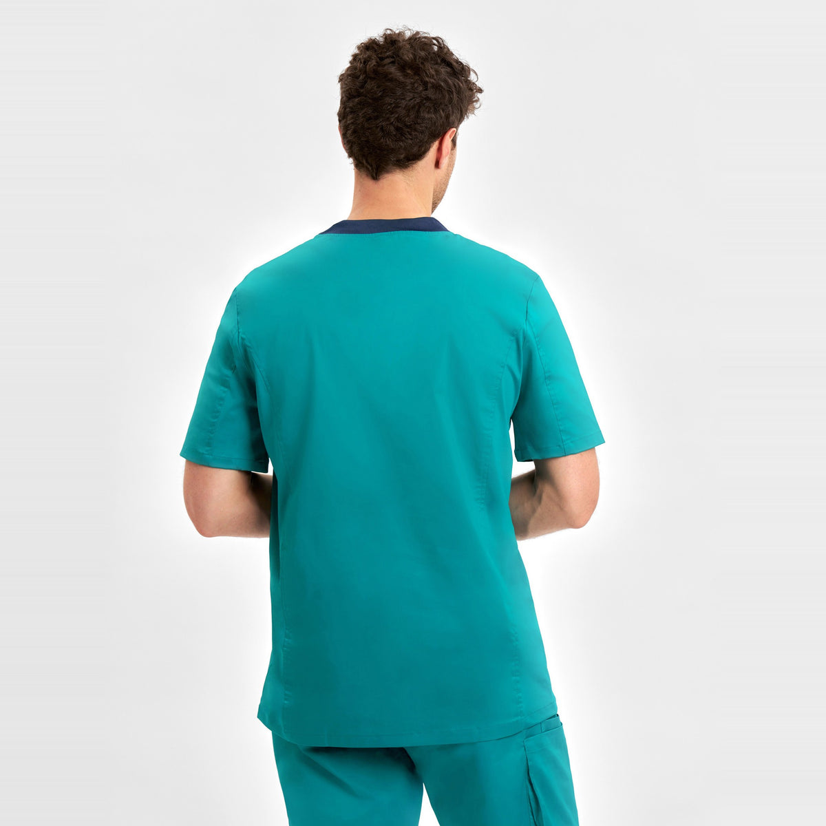Inaura Riley Mens Stretch Scrub Top CST043MS in Teal, worn by model, view 4