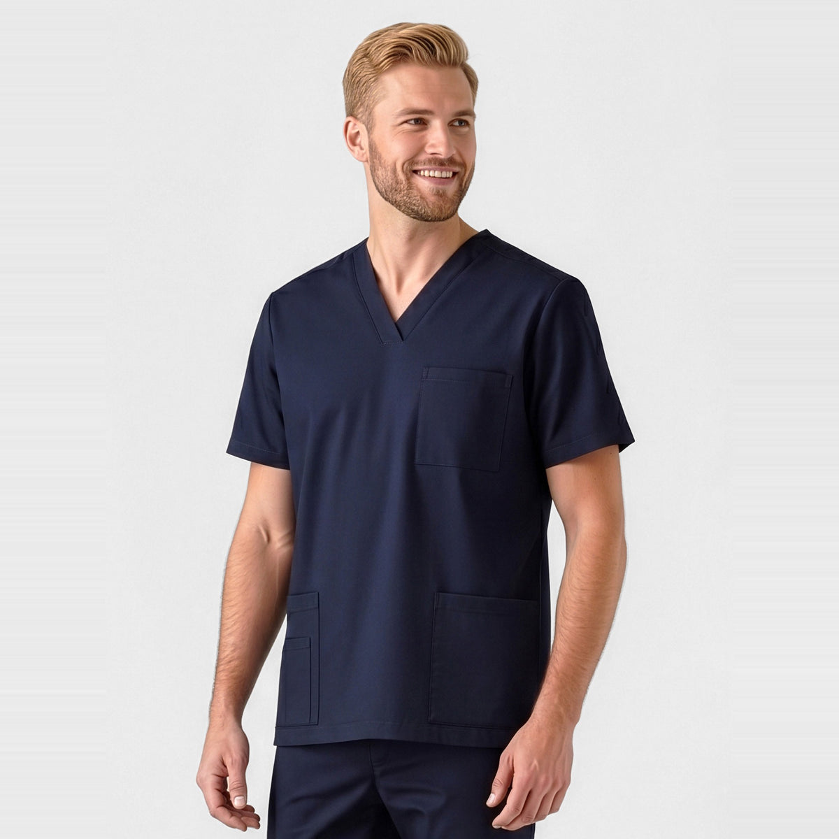 Inaura Tokyo Mens Scrub Top CST141MS in Midnight Navy, worn by model