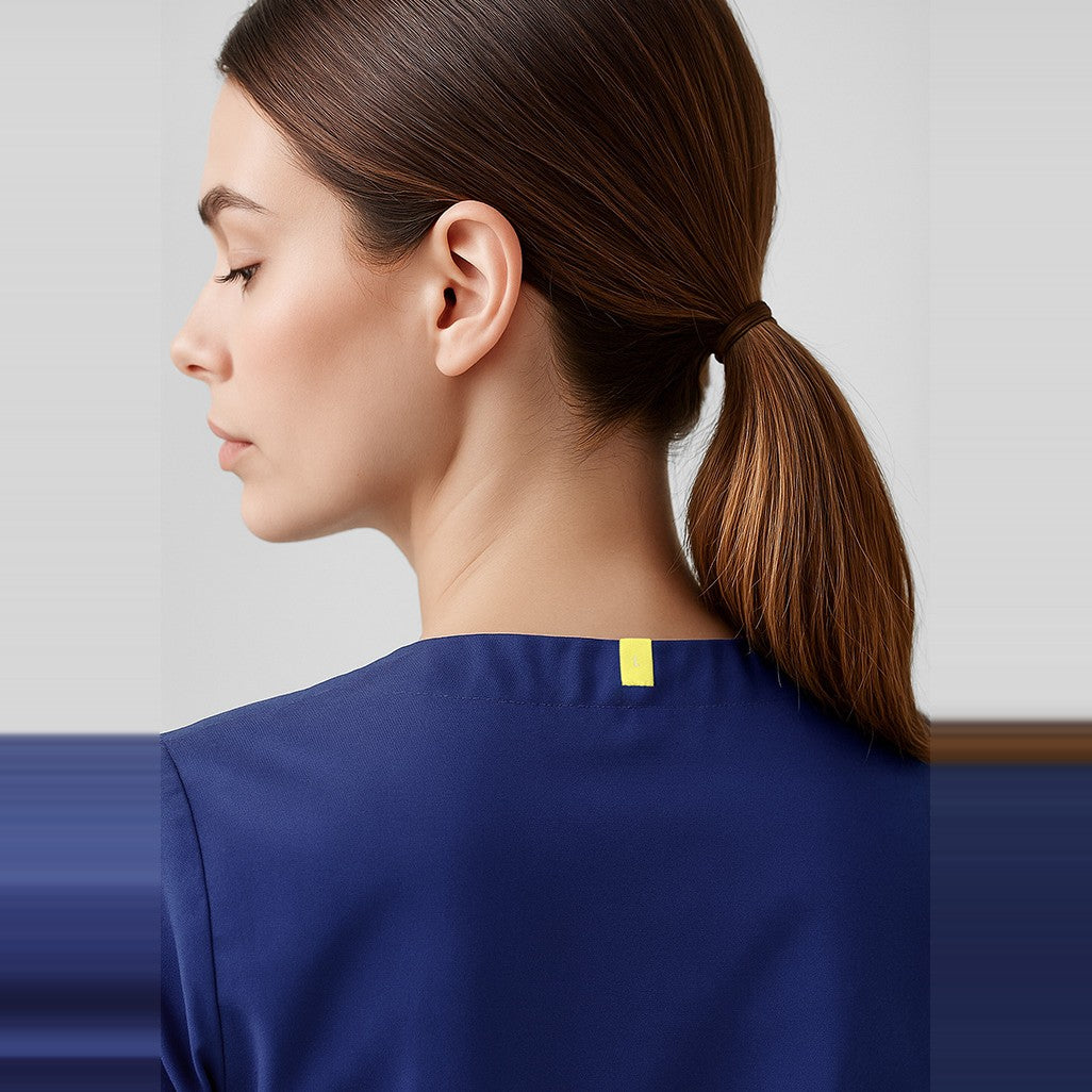 Inaura Hartwell Unisex Reversible Scrub Top CST150US in Dark Blue, worn by model, view 2