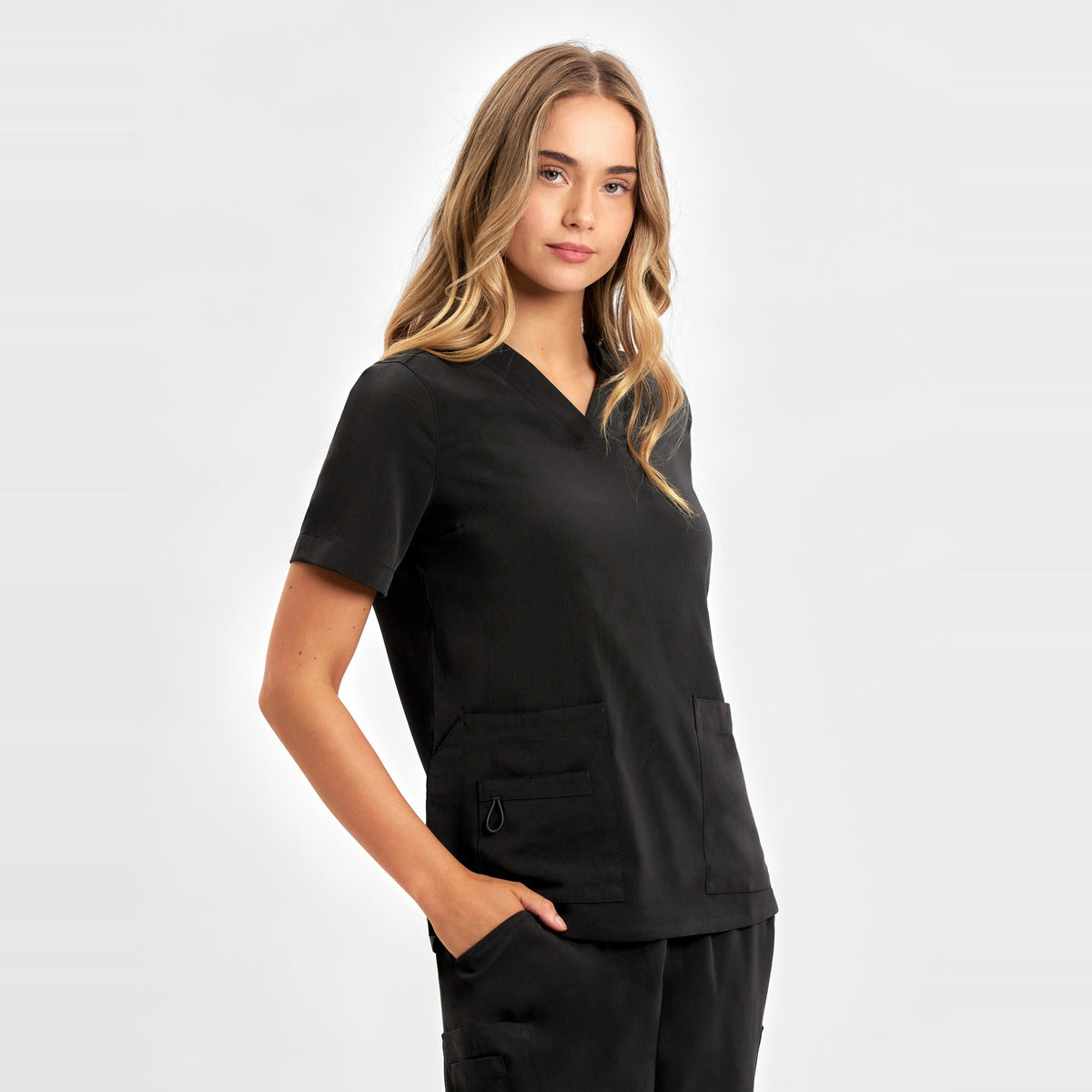 Inaura Avery Womens V-Neck Scrub Top CST941LS in Black, worn by model, view 3