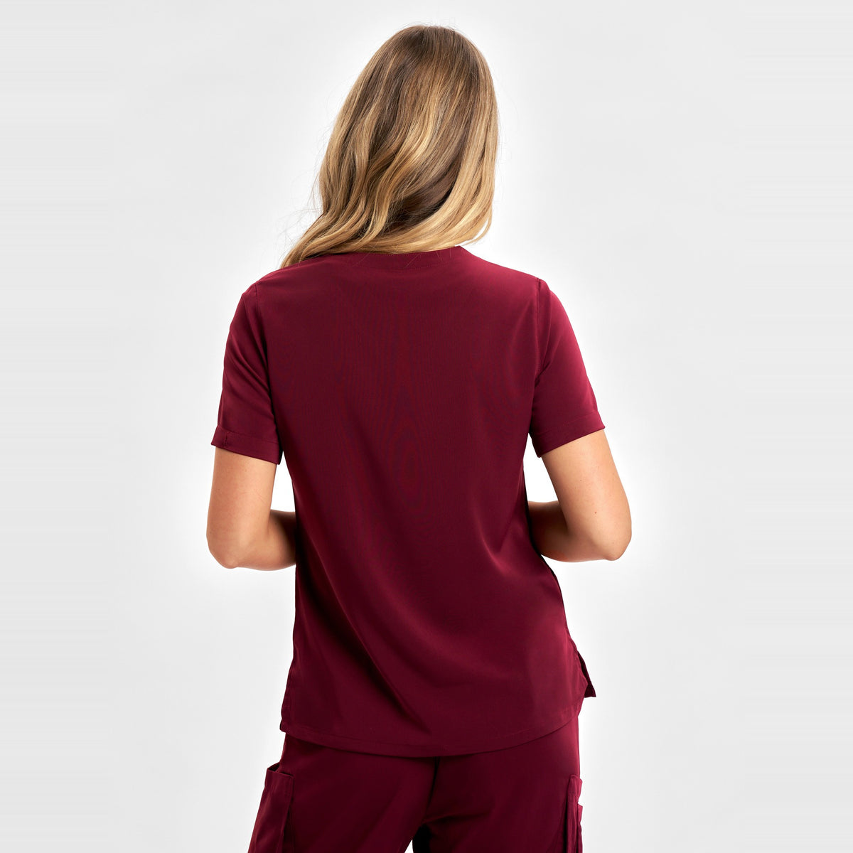 Inaura Avery Womens V-Neck Scrub Top CST941LS in Burgundy, worn by model, view 4