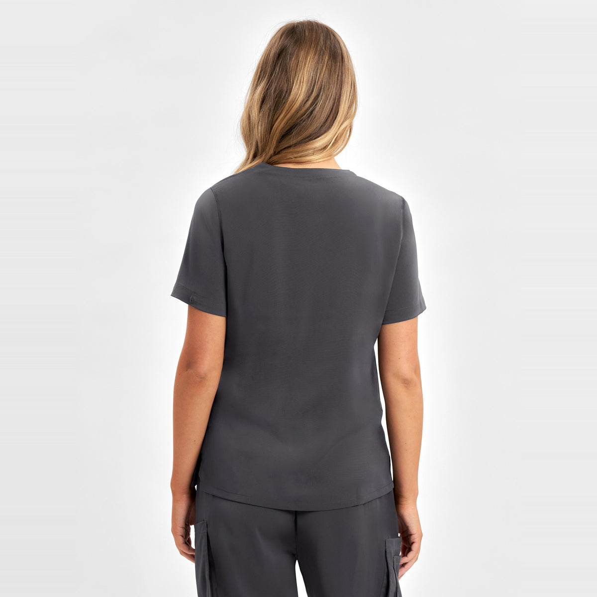 Inaura Avery Womens V-Neck Scrub Top CST941LS in Charcoal, worn by model, view 4