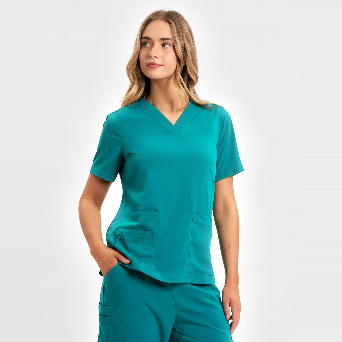 Inaura Avery Womens V-Neck Scrub Top CST941LS in Teal, worn by model, view 3