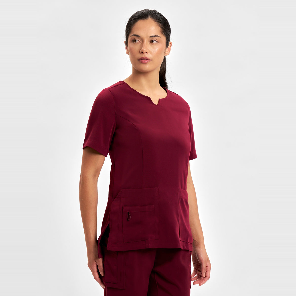 Inaura Avery Womens Round Neck Scrub Top CST942LS in Burgundy, worn by model, view 3